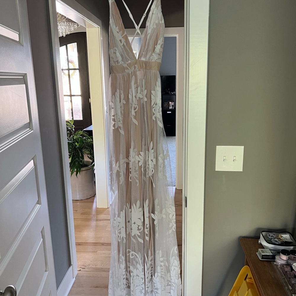 Boutique dress. New with tags on. Perfect for wedding rehearsal/bridal shower.